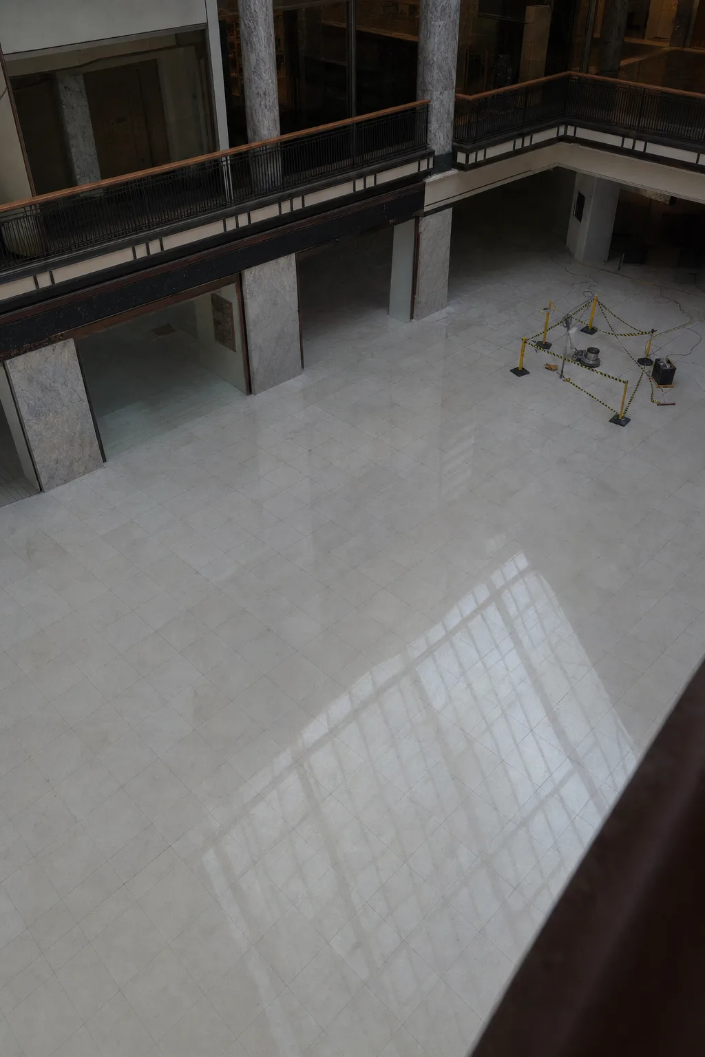 Restored marble flooring across a large retail atrium