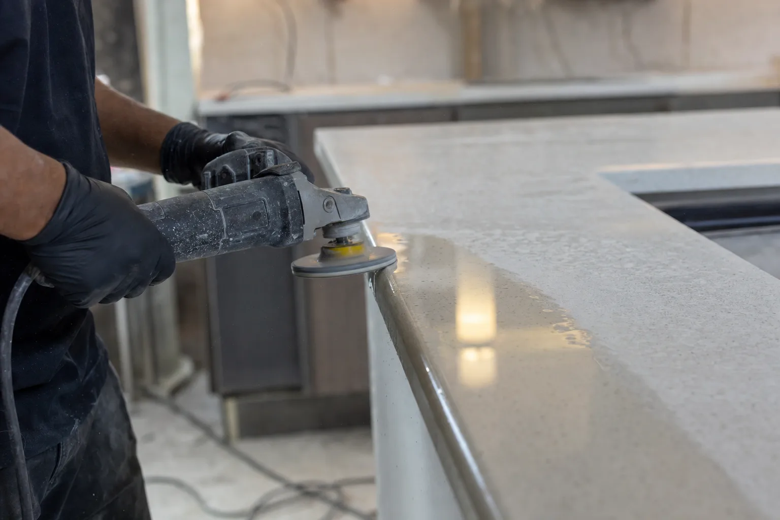 Polishing an engineered stone kitchen countertop by hand