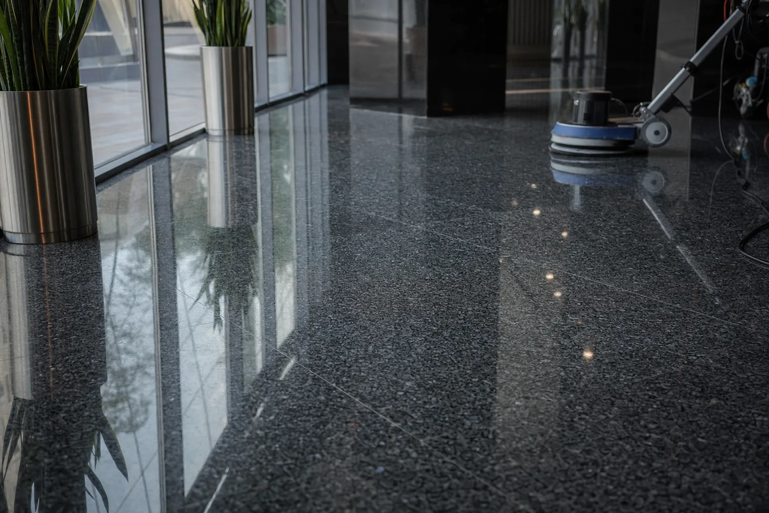 Polished dark granite floor in a corporate lobby
